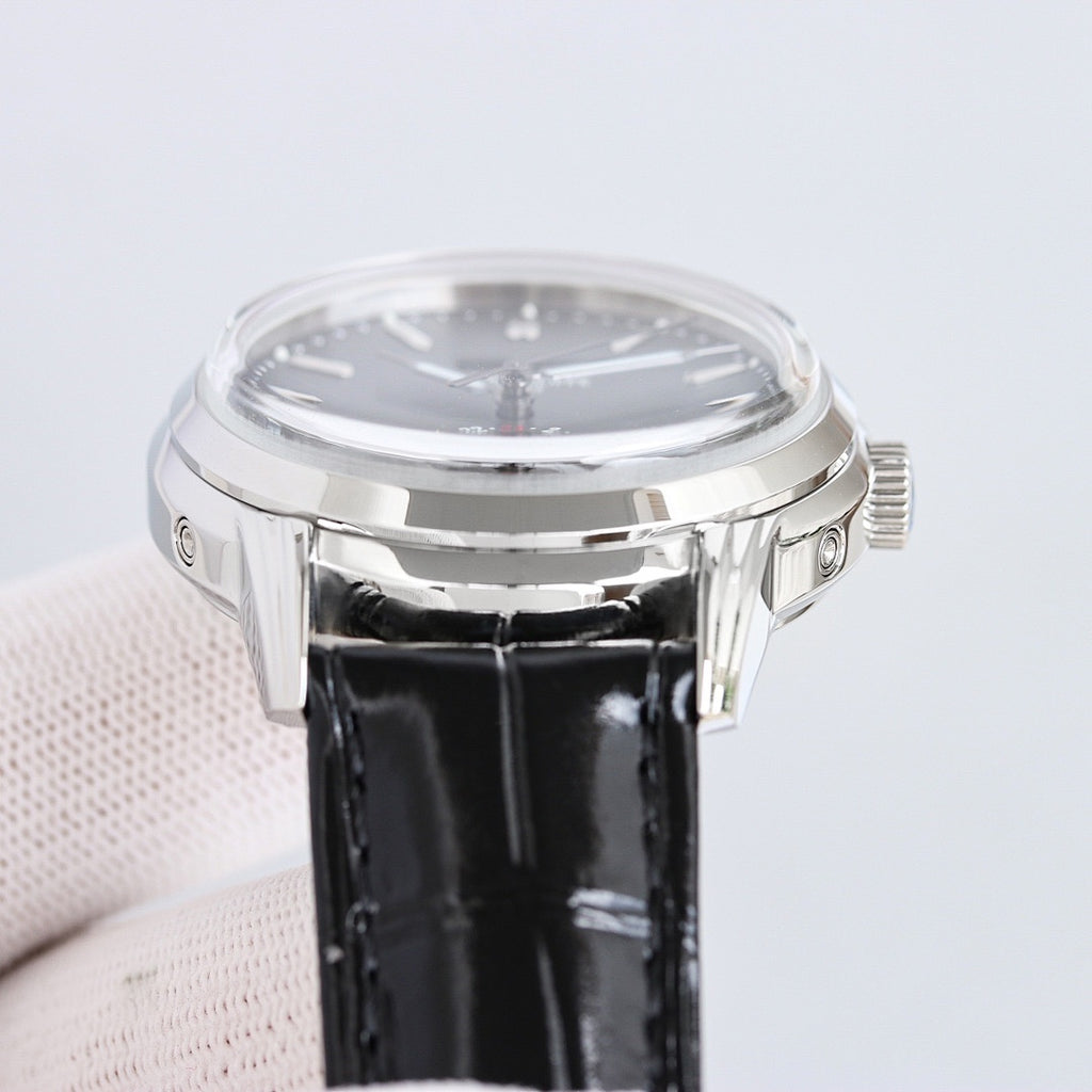 Patek Philippe wristwatch side view with black leather strap and polished silver case