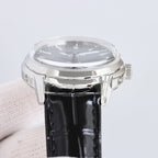 Patek Philippe wristwatch side view with black leather strap and polished silver case