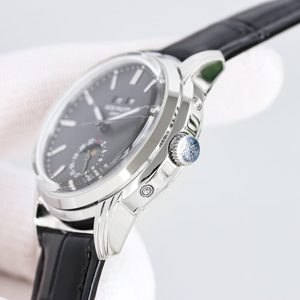 Patek Philippe wristwatch side view with crown and black leather strap