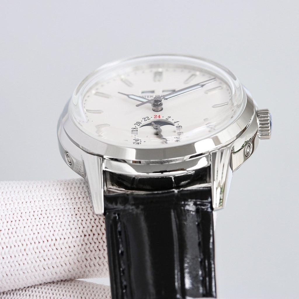 Patek Philippe watch top view with white dial, black leather strap, silver case