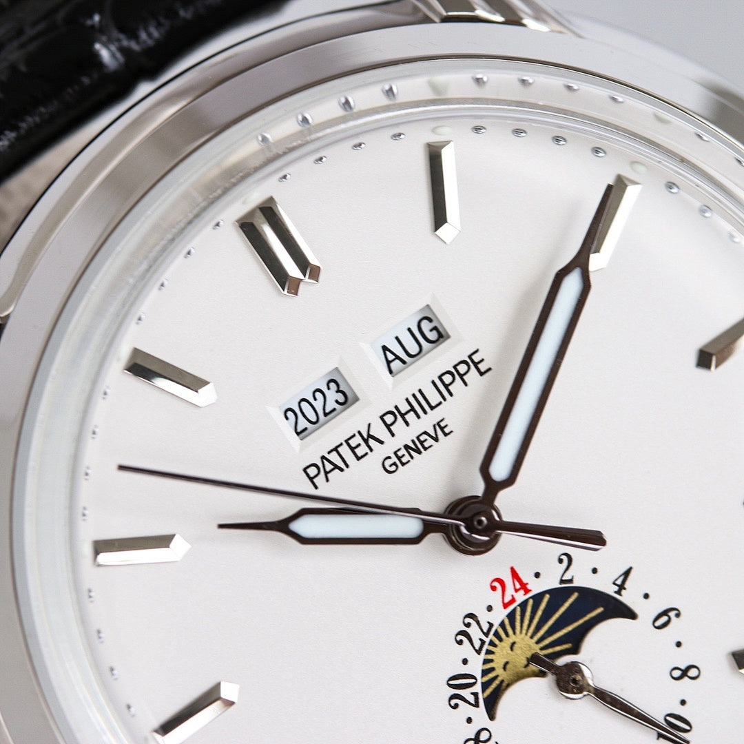 Patek Philippe watch dial close-up with gold-toned sunburst seconds subdial and baton markers