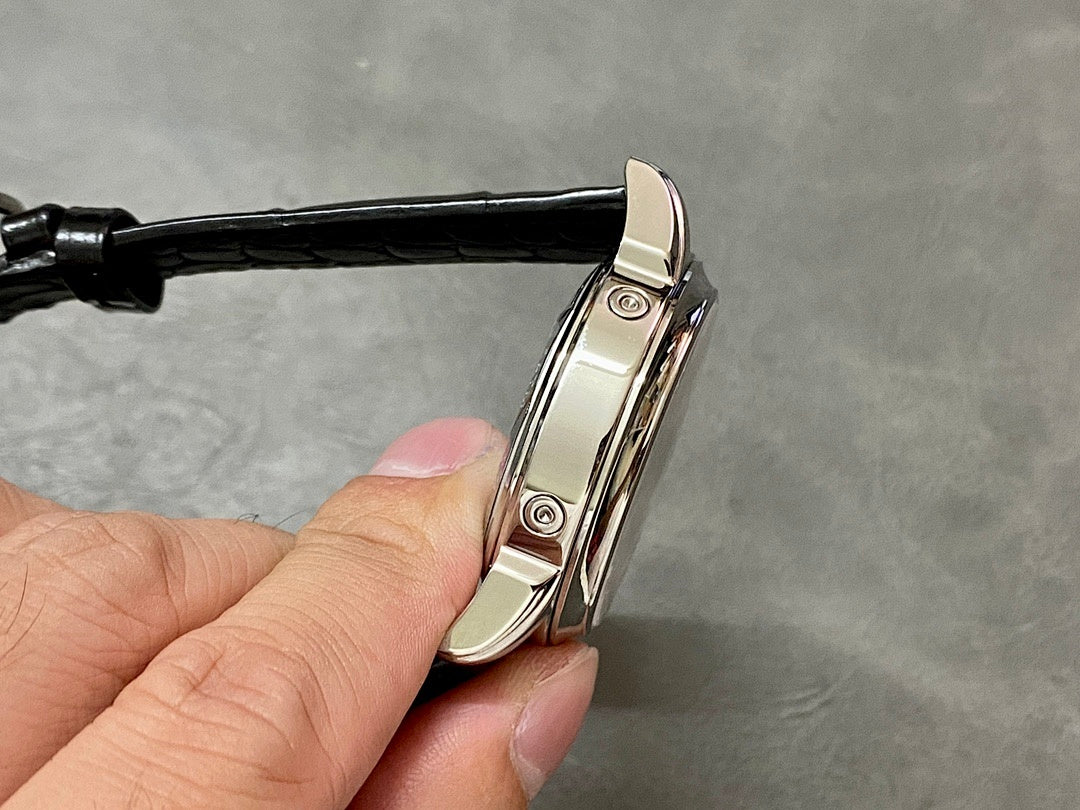 Wristwatch hinged clasp and case with black leather strap