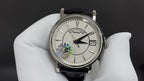 Patek Philippe wristwatch front view with white dial and black leather strap