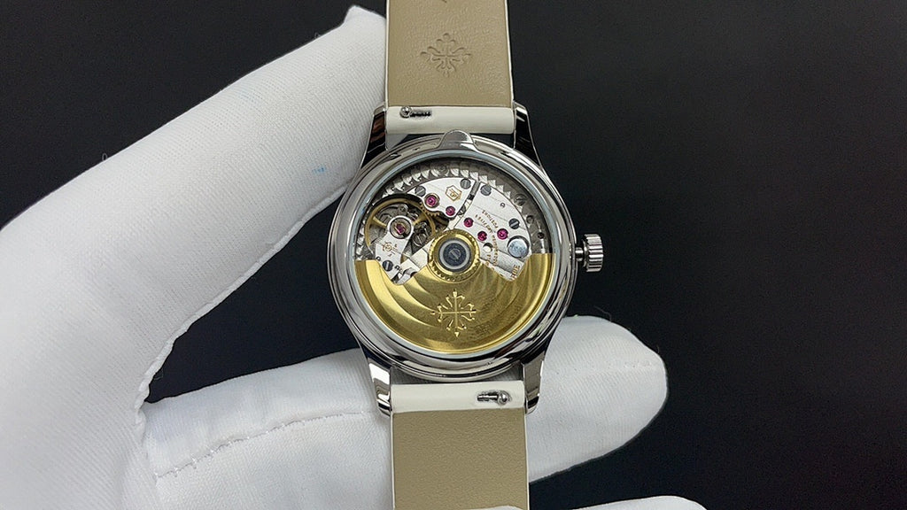 Wristwatch with exposed mechanical movement and light leather strap, stainless case