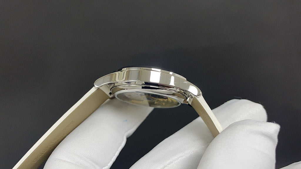 Wristwatch stainless case from side/top view with crown and polished bezel
