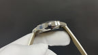 Wristwatch stainless case and crown detail on light leather strap