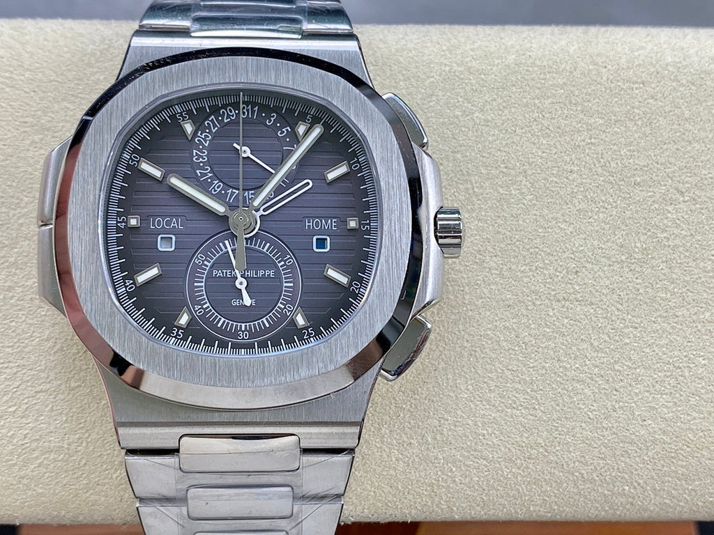 Stainless steel Patek Philippe wristwatch, black dial with bezel markers and subdials.