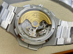 Patek Philippe wristwatch caseback with visible mechanical movement under glass.