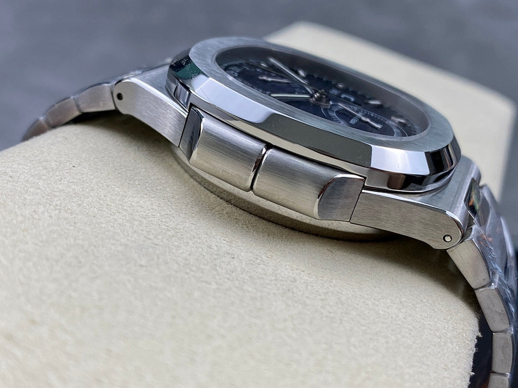 Stainless steel Patek Philippe wristwatch with ridged bezel edge in side profile.