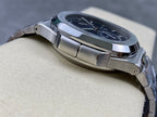 Stainless steel Patek Philippe wristwatch with ridged bezel edge in side profile.