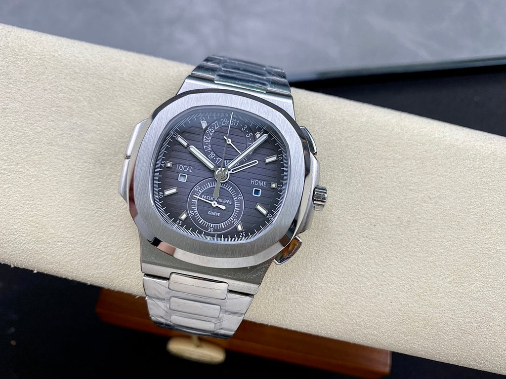 Stainless steel Patek Philippe wristwatch with black dial and subdial at 6 o'clock.
