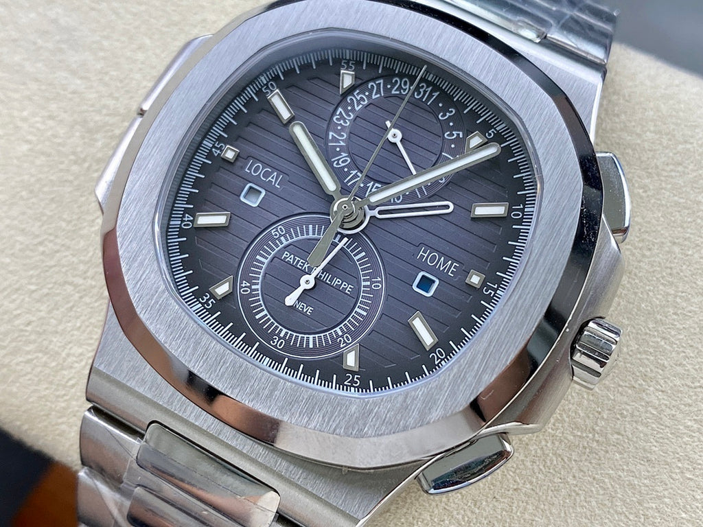 Stainless steel Patek Philippe wristwatch with black dial and dual-time subdials.