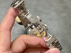 Patek Philippe watch with metal bracelet, shown from the side/back with clasp open