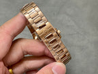 Gold-tone Patek Philippe wristwatch metal link bracelet, clasp side view