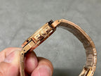 Gold-tone Patek Philippe wristwatch with hinged clasp, underside side view
