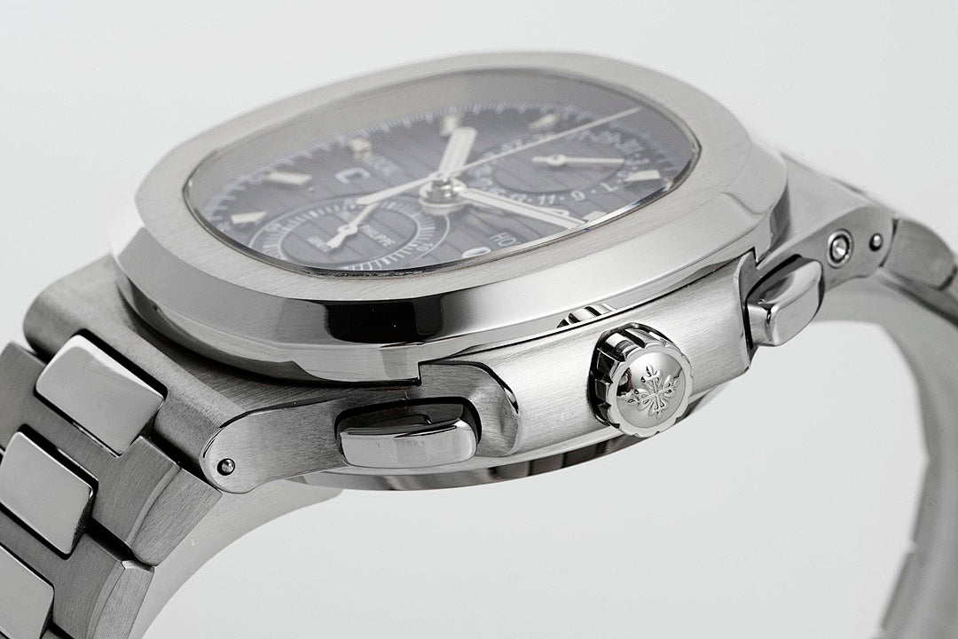 Stainless steel wristwatch with black dial from side angle, crown and pushers visible
