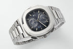 Stainless steel wristwatch with black dial, crown side view, subdials and date window