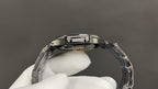 Patek Philippe watch case from side angle with diamond bezel and metal bracelet