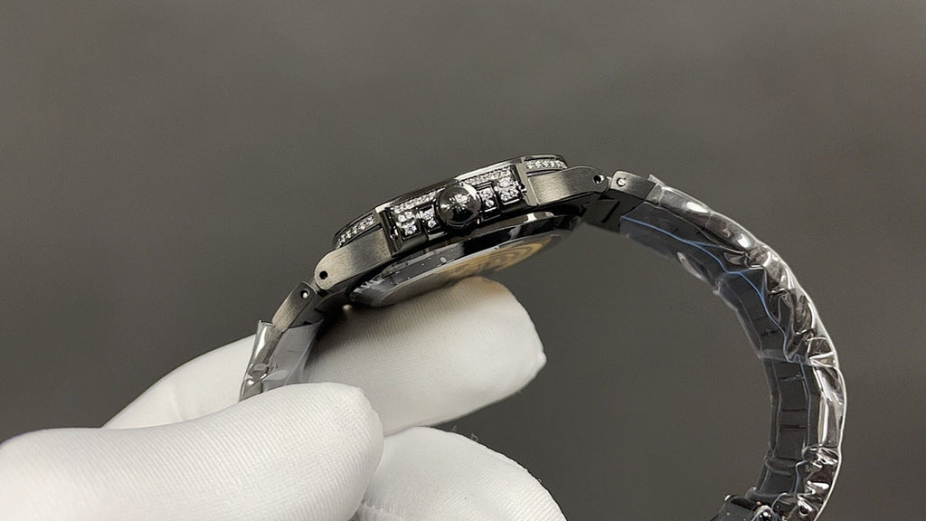 Patek Philippe watch case and metal bracelet viewed from side in hand