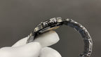 Patek Philippe watch case and metal bracelet viewed from side in hand