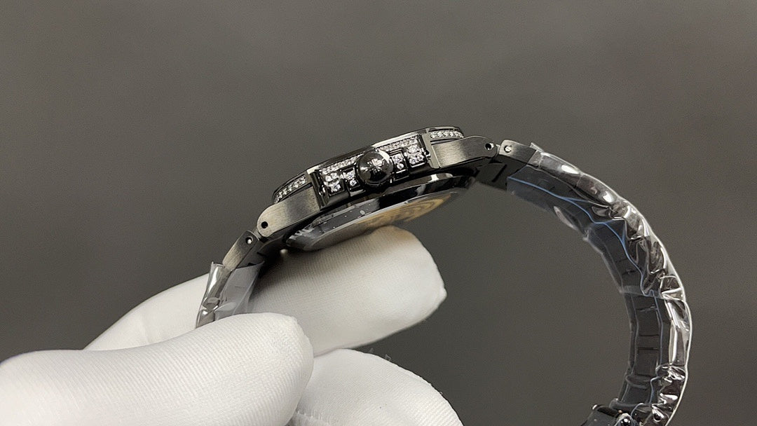 Patek Philippe watch case and metal bracelet viewed from side in hand