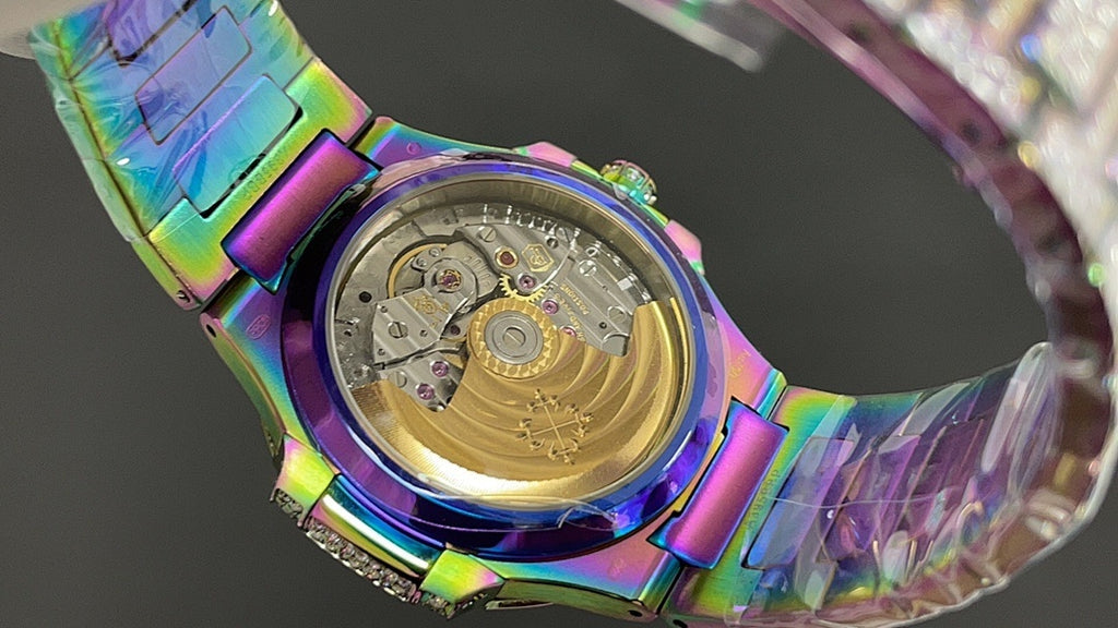 Jeweled watch case back with rainbow iridescent finish and gold-toned movement details