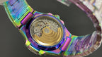 Jeweled watch case back with rainbow iridescent finish and gold-toned movement details
