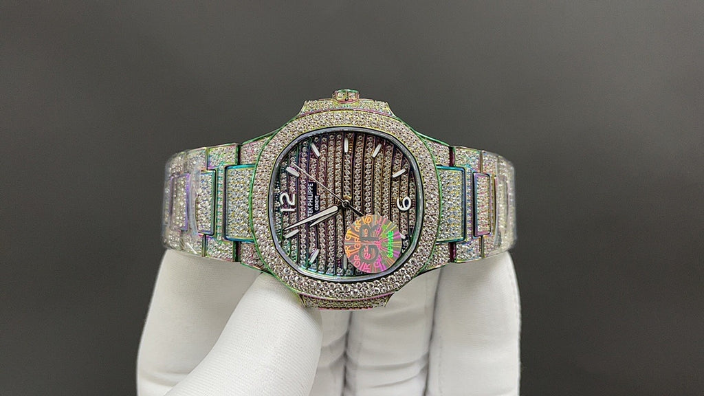 Jeweled wristwatch with iridescent bracelet, dark dial, and diamond-set bezel