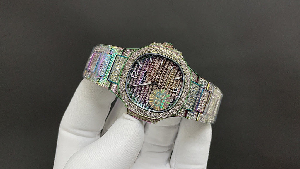 Jeweled wristwatch with iridescent bracelet and multicolor dial viewed at an angle