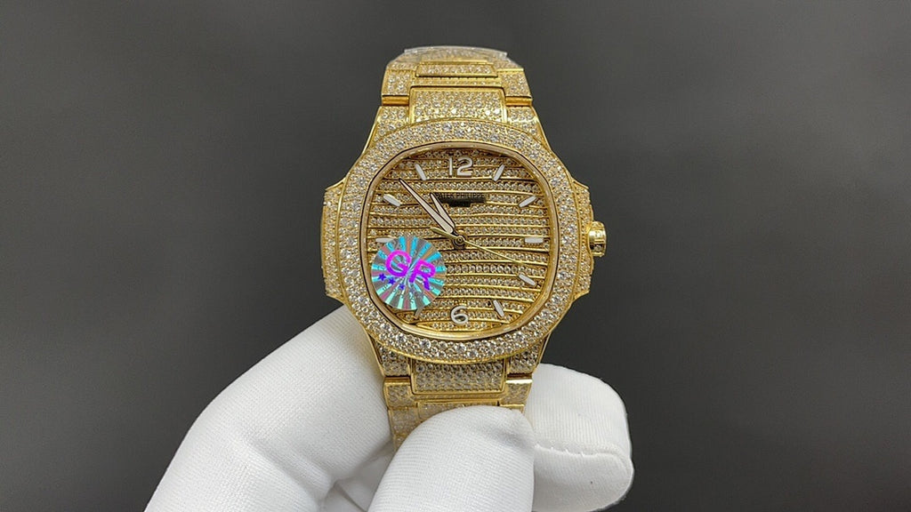 Patek Philippe gold-tone wristwatch with diamond bezel and multicolor dial detail