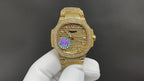 Patek Philippe gold-tone wristwatch with diamond bezel and multicolor dial detail
