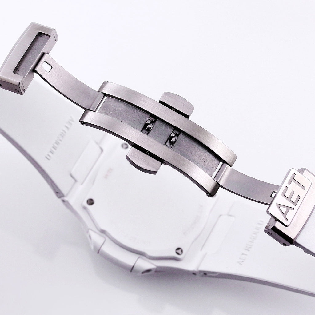 Patek Philippe watch case with white rubber strap and metal buckle clasp
