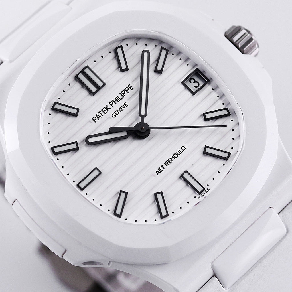 Patek Philippe watch face close-up with white dial and bold dark hour markers