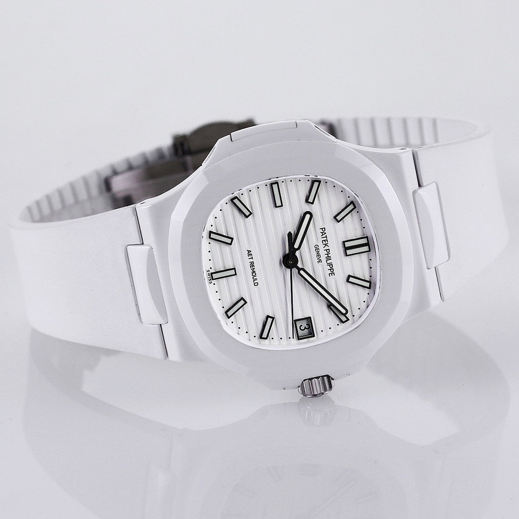 Patek Philippe watch with white dial, dark hour markers, and white strap