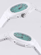White sport watch with turquoise dial and black bezel detailing, side profile