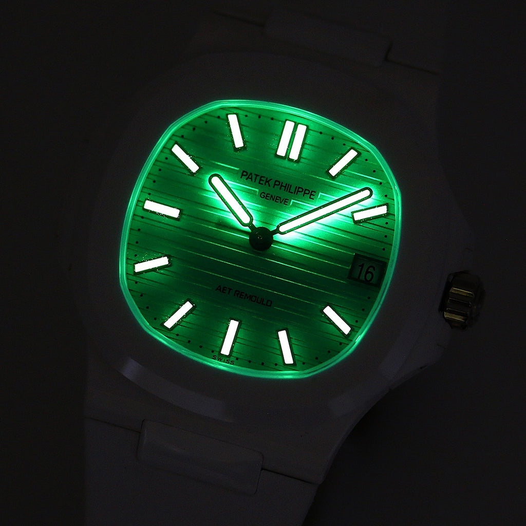 Luminous turquoise sport watch face with black markers, hands, and date
