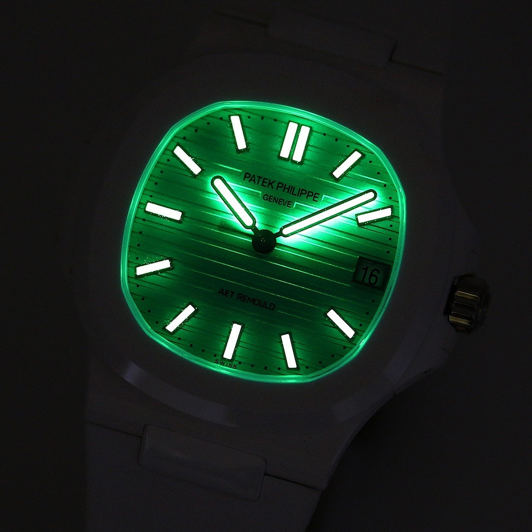 Luminous turquoise sport watch face with black markers, hands, and date