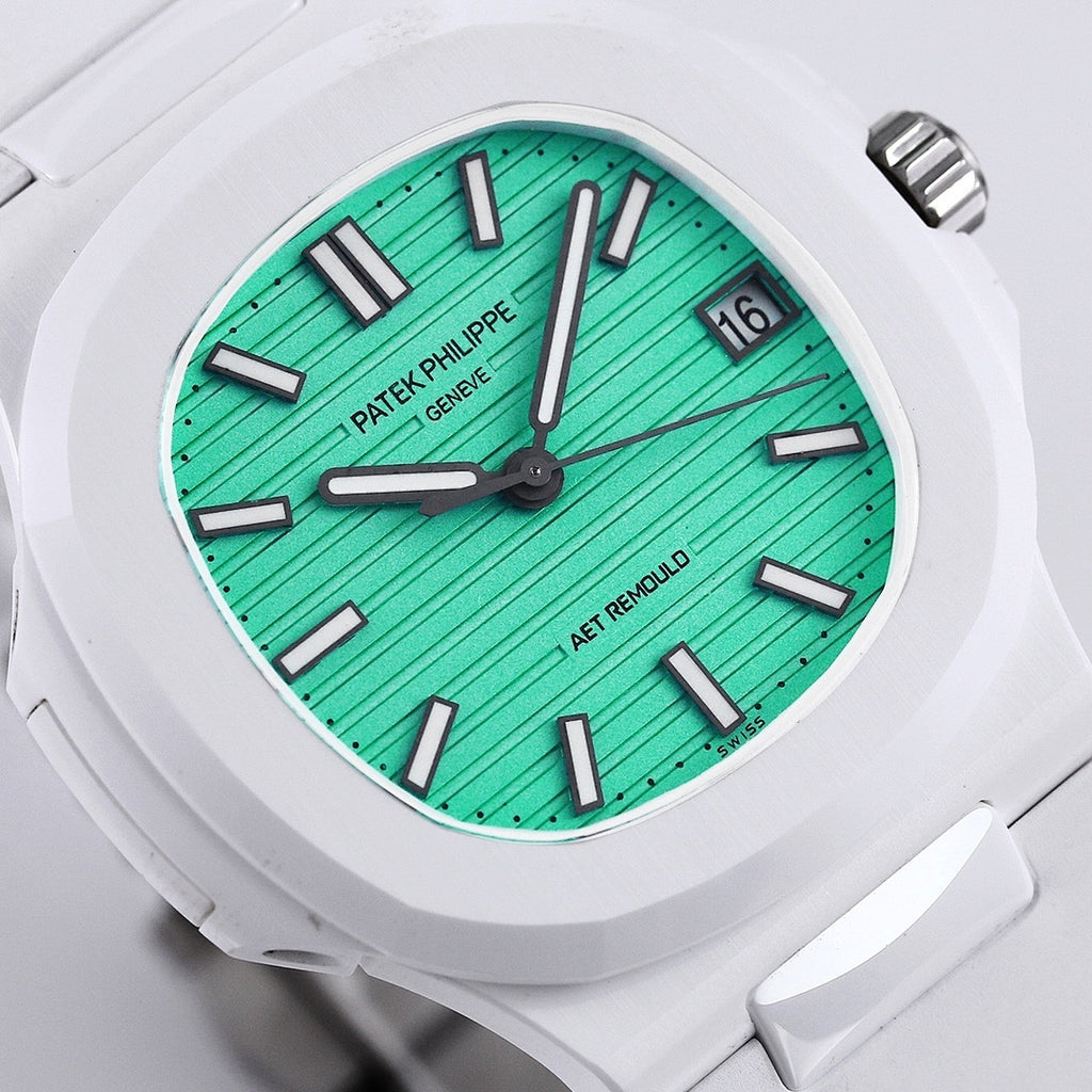 Turquoise dial sport watch with black baton markers, hands, and date at 16