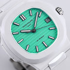 Turquoise dial sport watch with black baton markers, hands, and date at 16