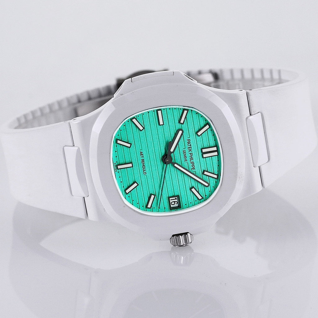 White sport watch with turquoise dial, black hour markers, and metal crown