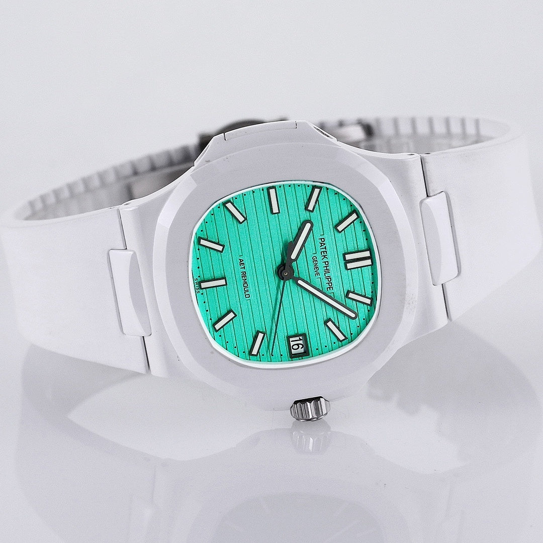 White sport watch with turquoise dial, black hour markers, and metal crown