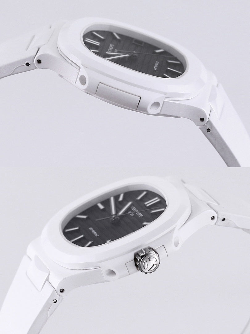 Patek Philippe watch side view, white case with crown, black dial.