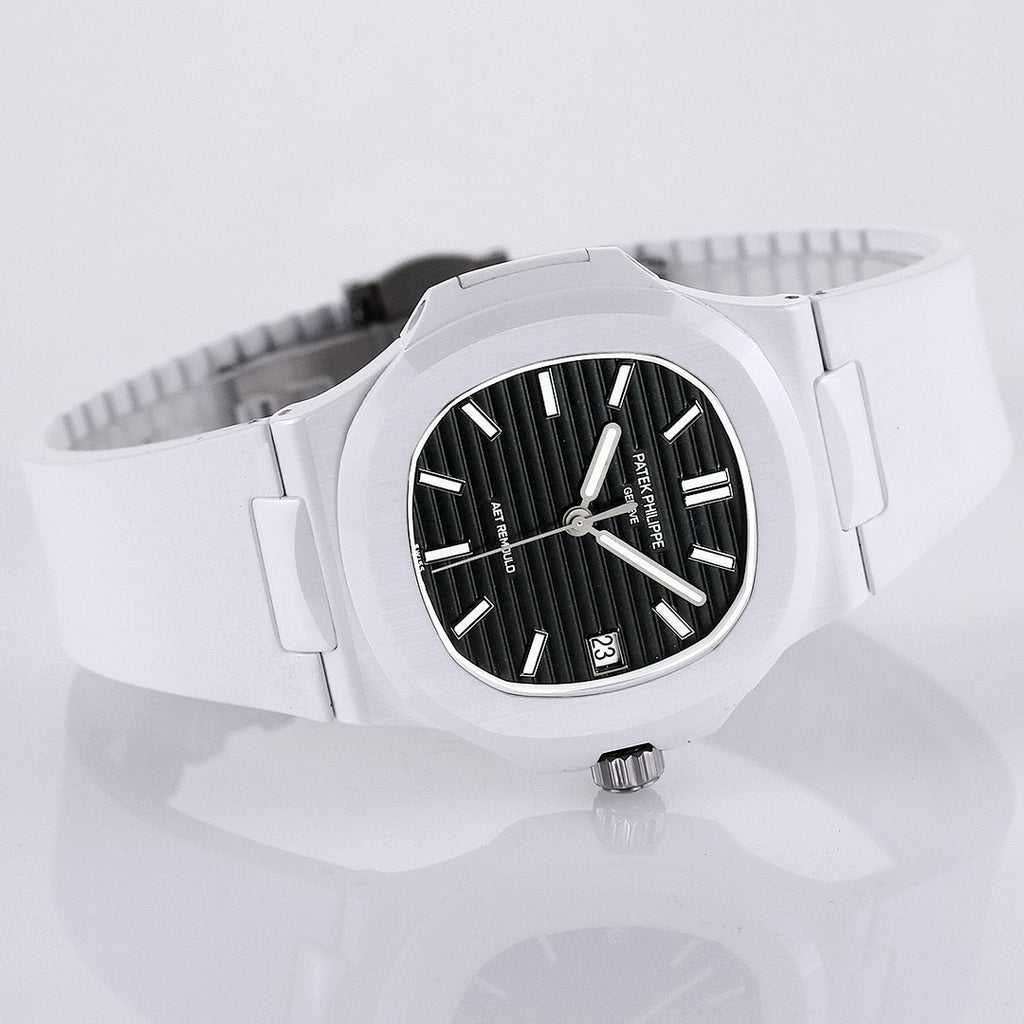 Patek Philippe watch angled view, white rubber strap and black dial with date window.