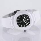 Patek Philippe watch angled view, white rubber strap and black dial with date window.