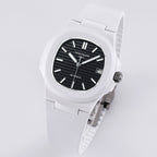 Patek Philippe watch 3/4 view, white rubber strap, black dial with date window.