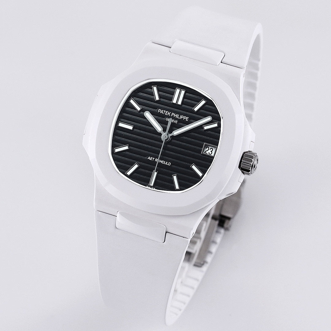 Patek Philippe watch 3/4 view, white rubber strap, black dial with date window.