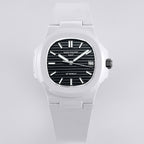 Patek Philippe watch front view, white rubber strap and black dial with date window at 23.