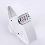 Patek Philippe watch, white strap and clasp, close-up of metal buckle with raised letters