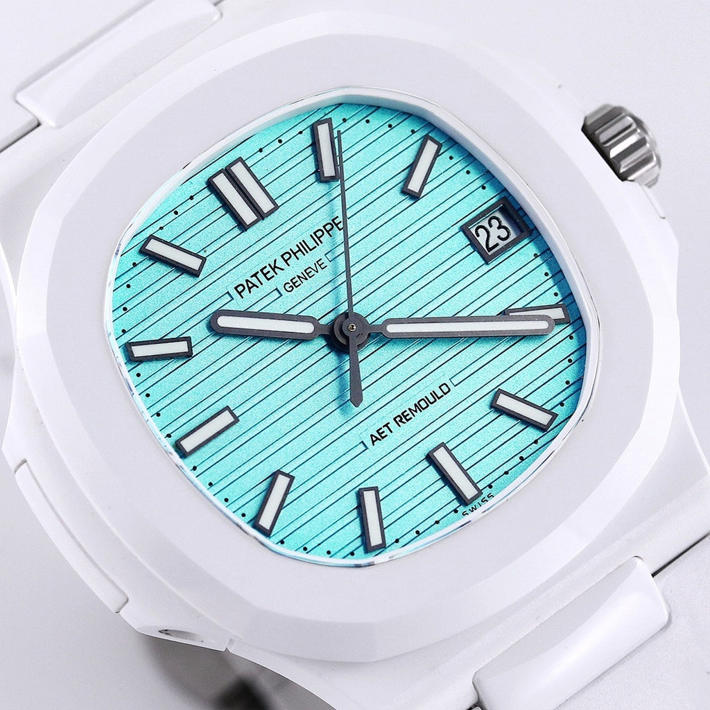 Patek Philippe watch close-up, turquoise textured dial, black hour markers, date window at 23