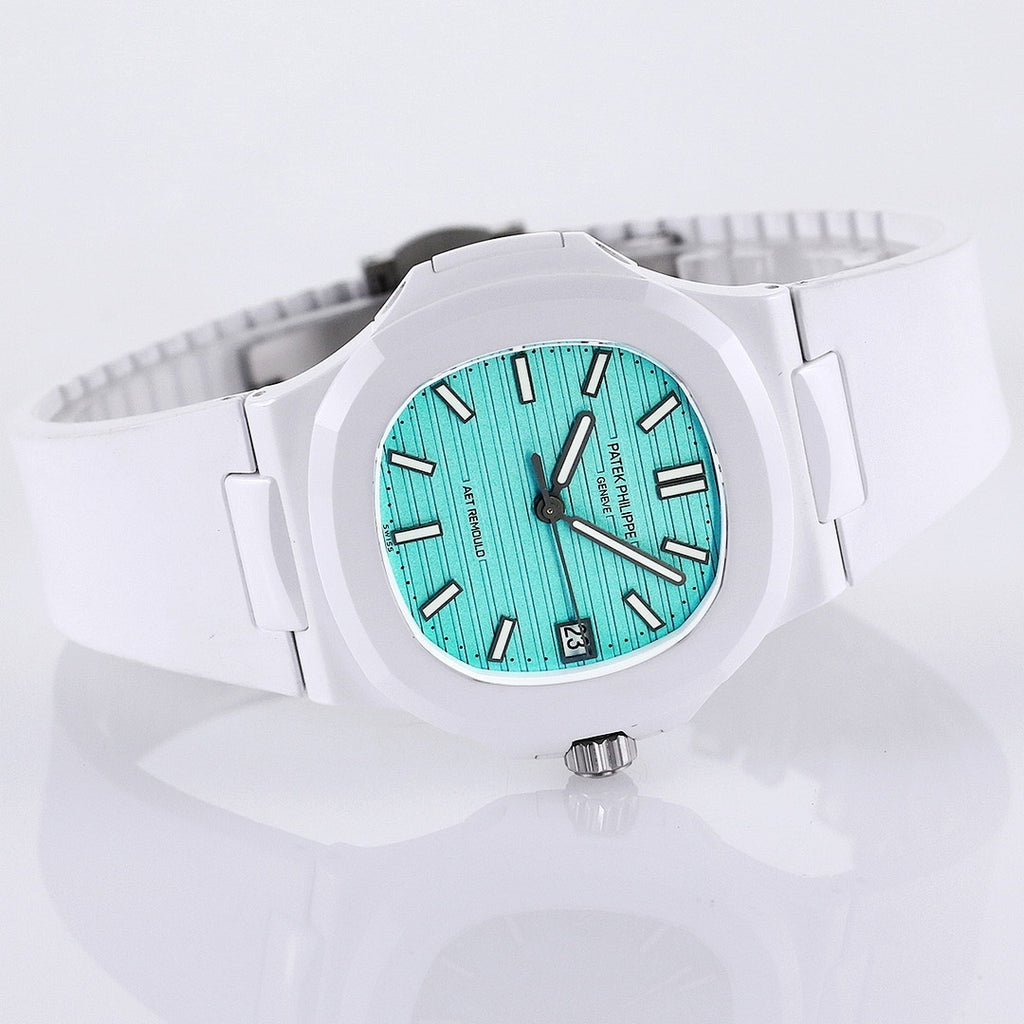 Patek Philippe watch, turquoise dial, white rubber strap, wide side view with visible bezel